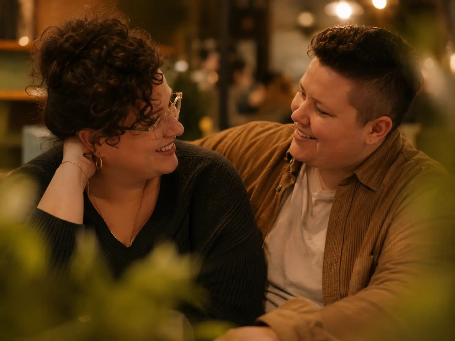A couple sharing a meal and laughing together